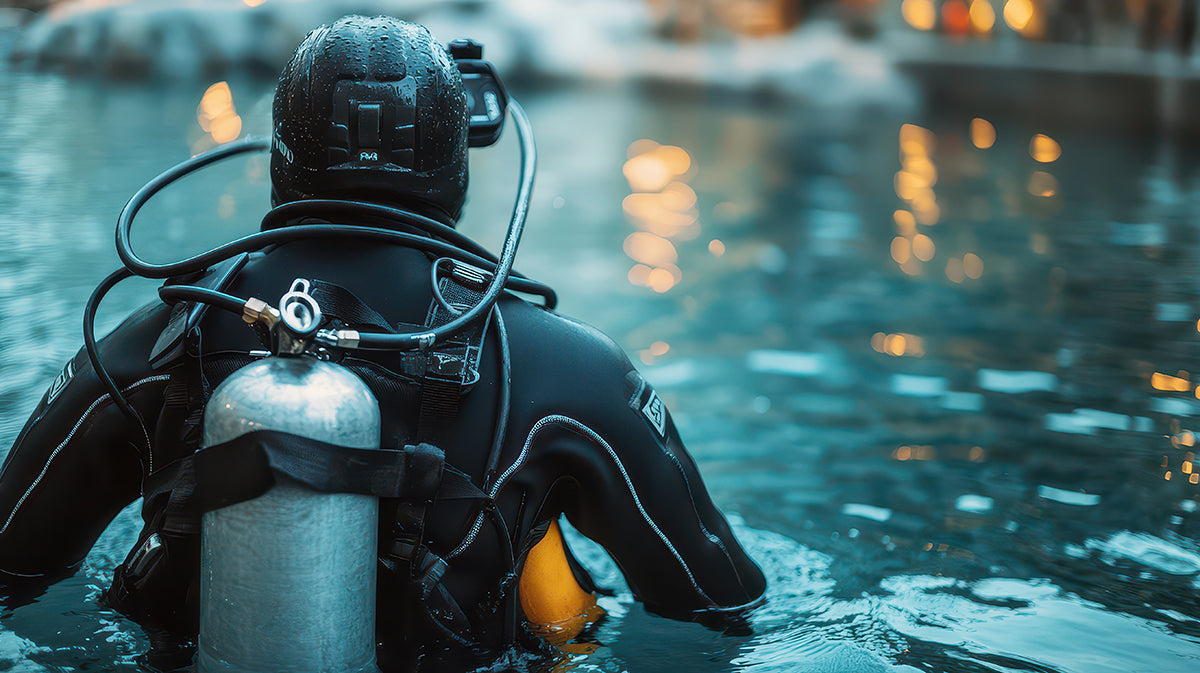 Diver in a wetsuit with scuba gear in water